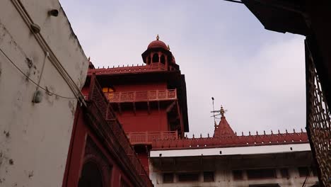 ancient-artistic-red-stone-holy-jain-temple-at-morning-video-is-taken-at-Soni-Ji-Ki-Nasiya-Jain-Temple,-Ajmer,-Rajasthan,-India