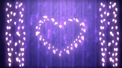 glowing heart and strings of fairy lights on purple background