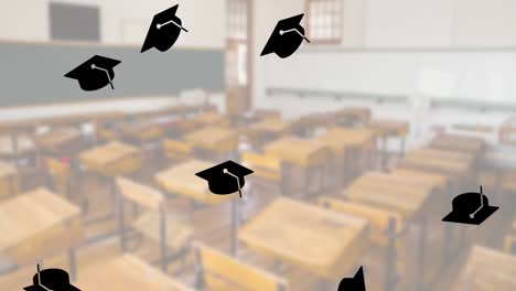 Multiple-graduation-hat-icons-falling-against-view-of-empty-classroom-at-school