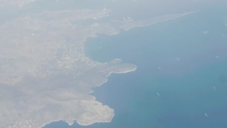 stunning aerial shot of athens and ships travelling to port