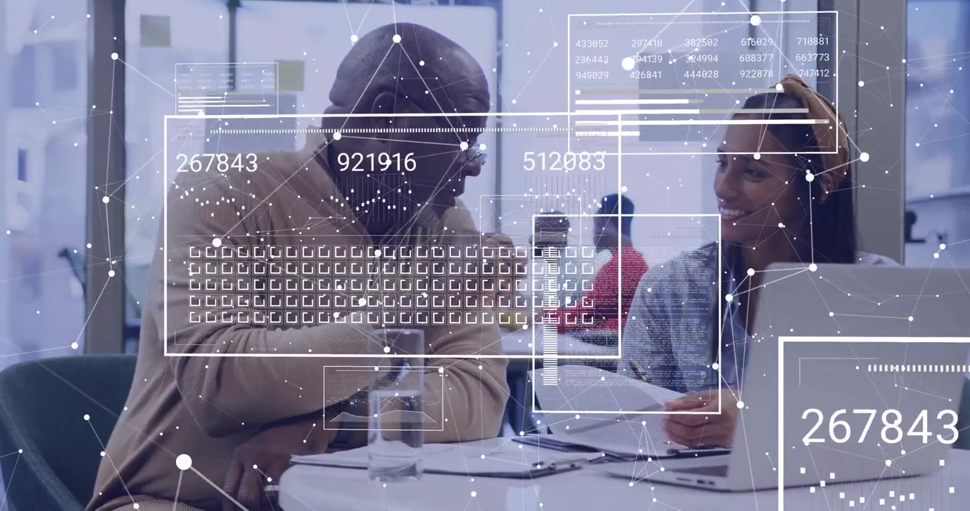 Opening document initiating network overlay while colleagues analyzing business data on laptop
