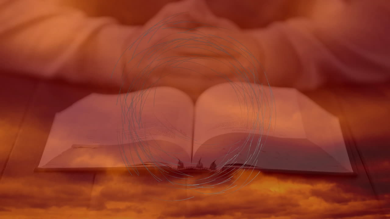 Open book with animation of abstract circular design on warm-toned background