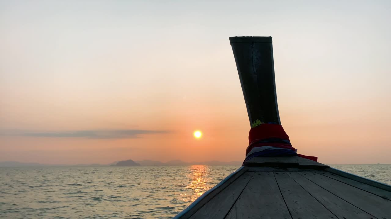 Landscape of the head front of local boat while sailing in sea ocean in early morning time