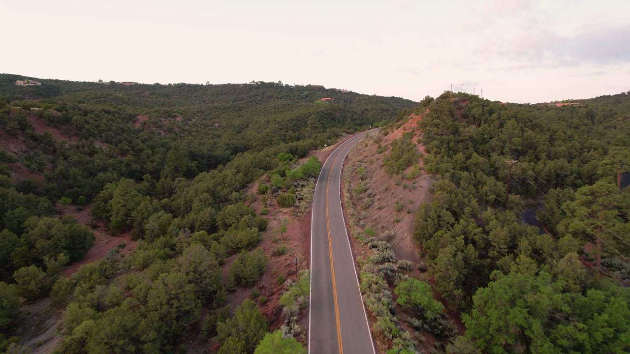 Santa Fe National Forest empty rural road road trip destination nature surrounded aerial drone