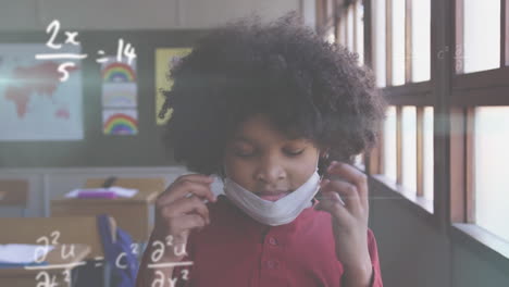 animation of floating mathematical equations over girld wearing a face mask sitting in a classroom