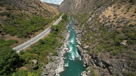 scenic route beside kawarau river and canyon, road trip scenery of new zealand - drone