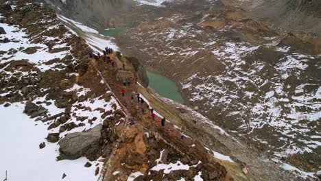 tourists marvel from edge at breathtaking annapurna mountain vistas,aerial