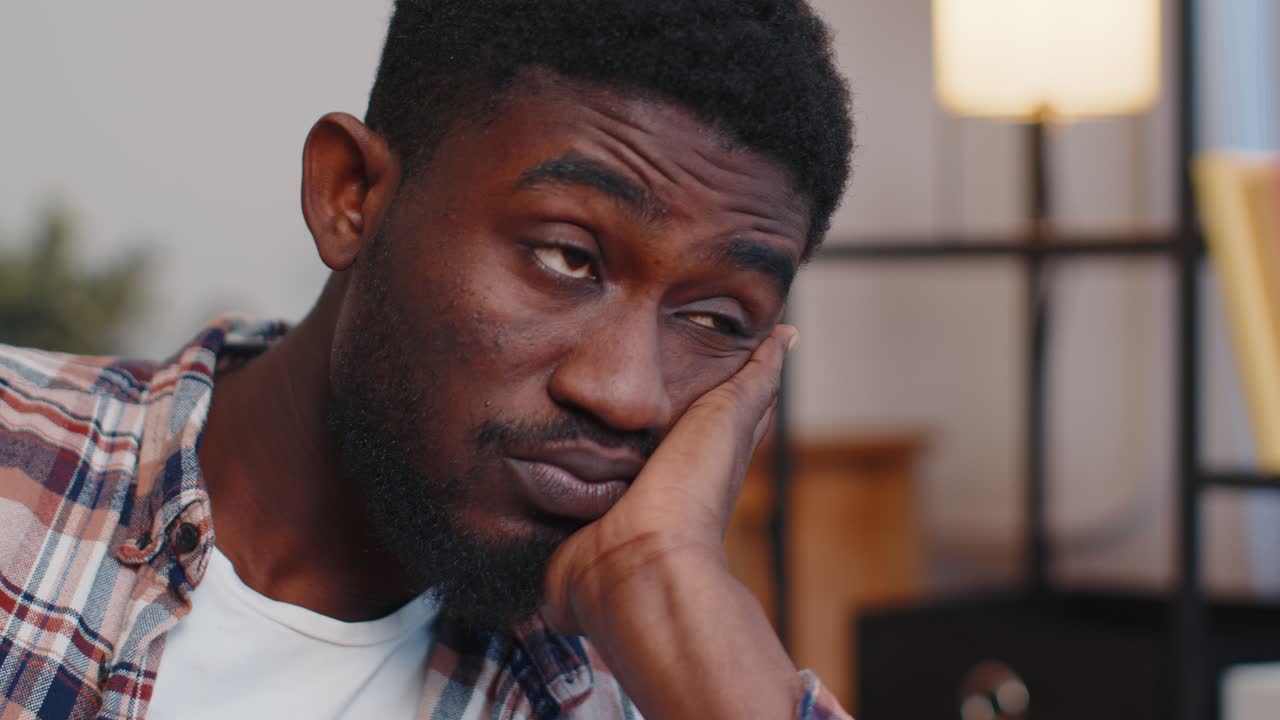 African american man at home suffers from unfair situation problem break up depressed feeling bad