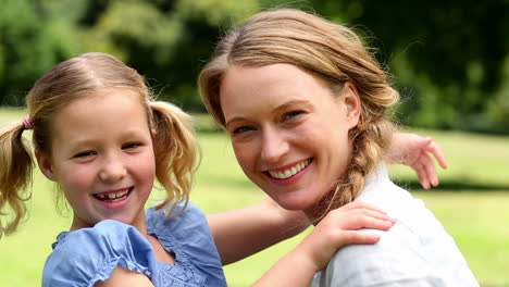 happy mother with her little girl in the park