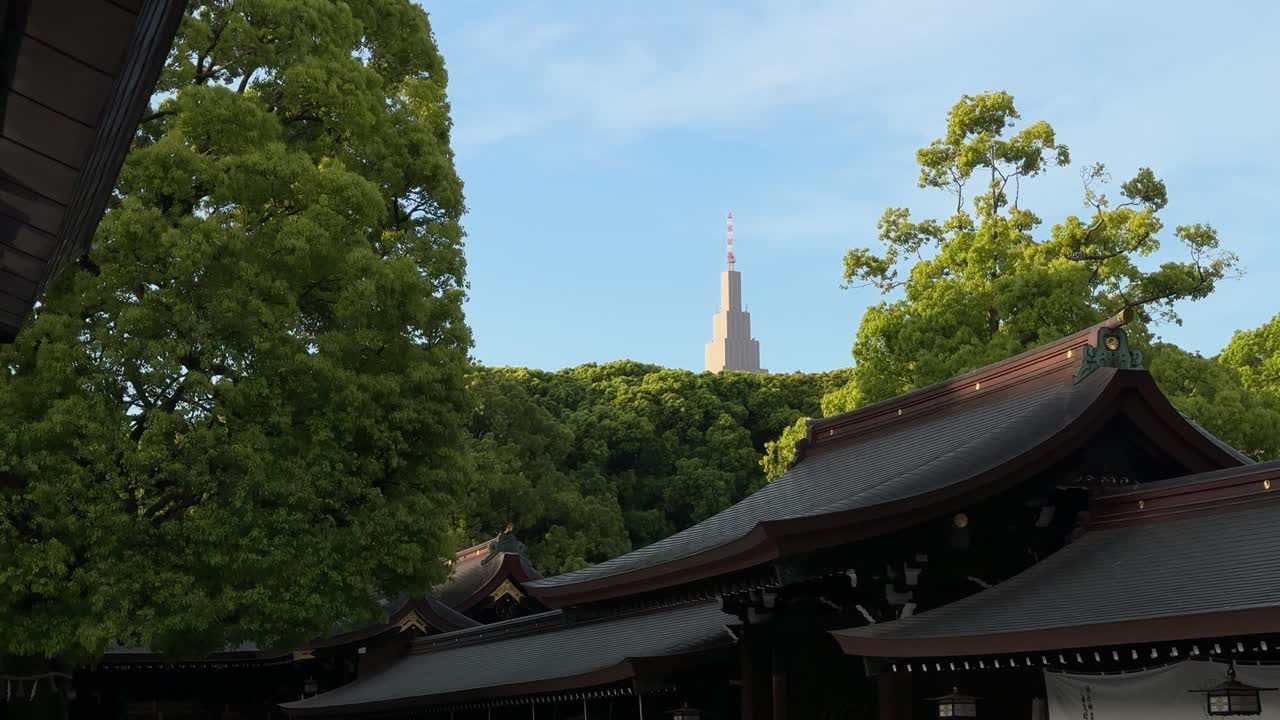 Meiji Jingu Shrine in Tokyo, Japan NTT Docomo Yoyogi Building visible in the background