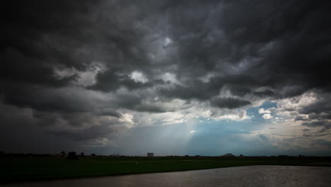 dramatic low lying rumbly storm clouds rolling overhead as the south east asia monsoon season sets in.