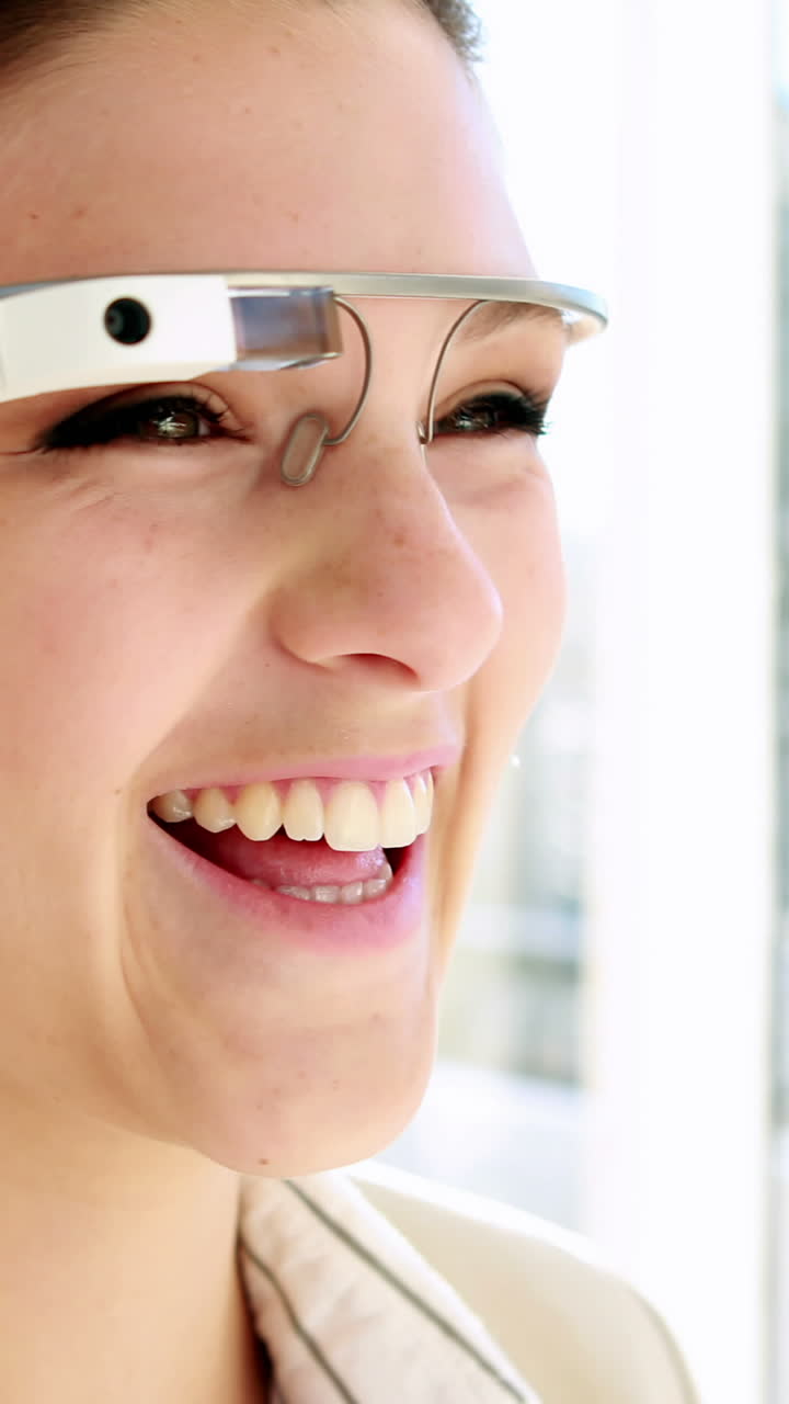 Pretty businesswoman using smart glasses