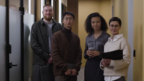 business team portrait in modern office corridor