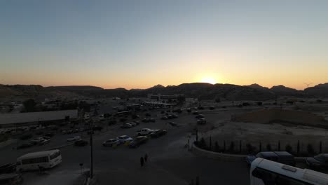 timelapse of a beautiful sunset in petra valley in wadi musa, jordan in the middle of a rocky and mountainous landscape, an unesco heritage site, ancient nabatean kingdom 4k establish shot
