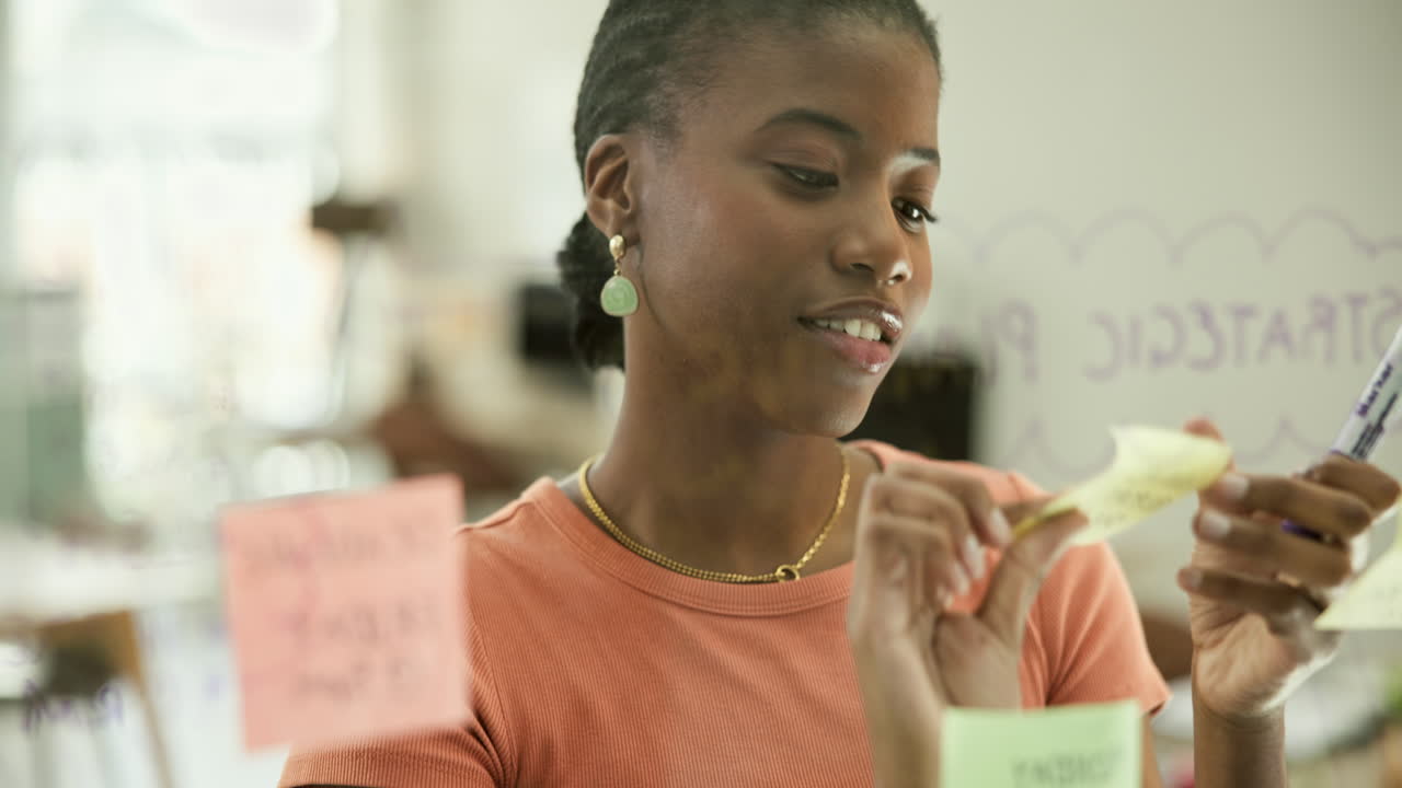 Woman Brainstorming Ideas in Office