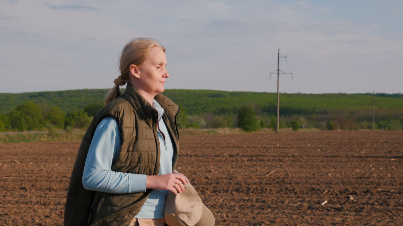 Woman Walking Through a Field