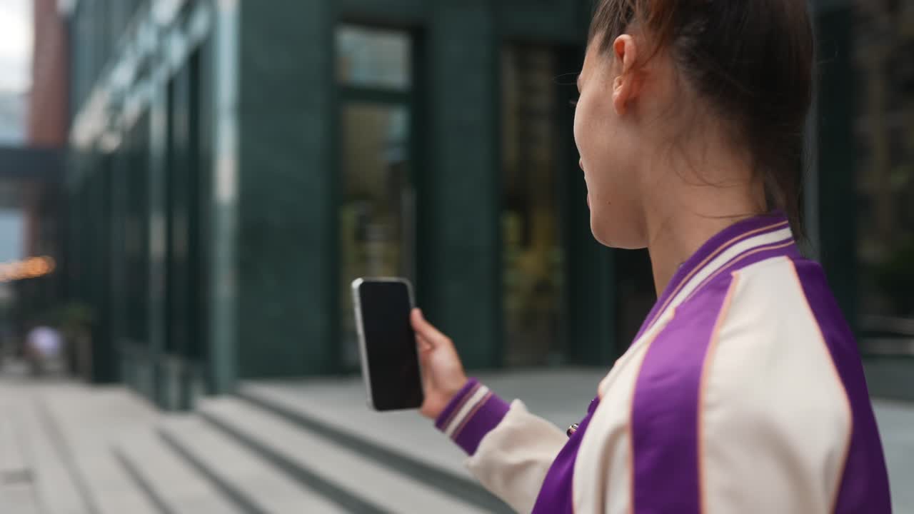 Woman Talking Outdoors in City