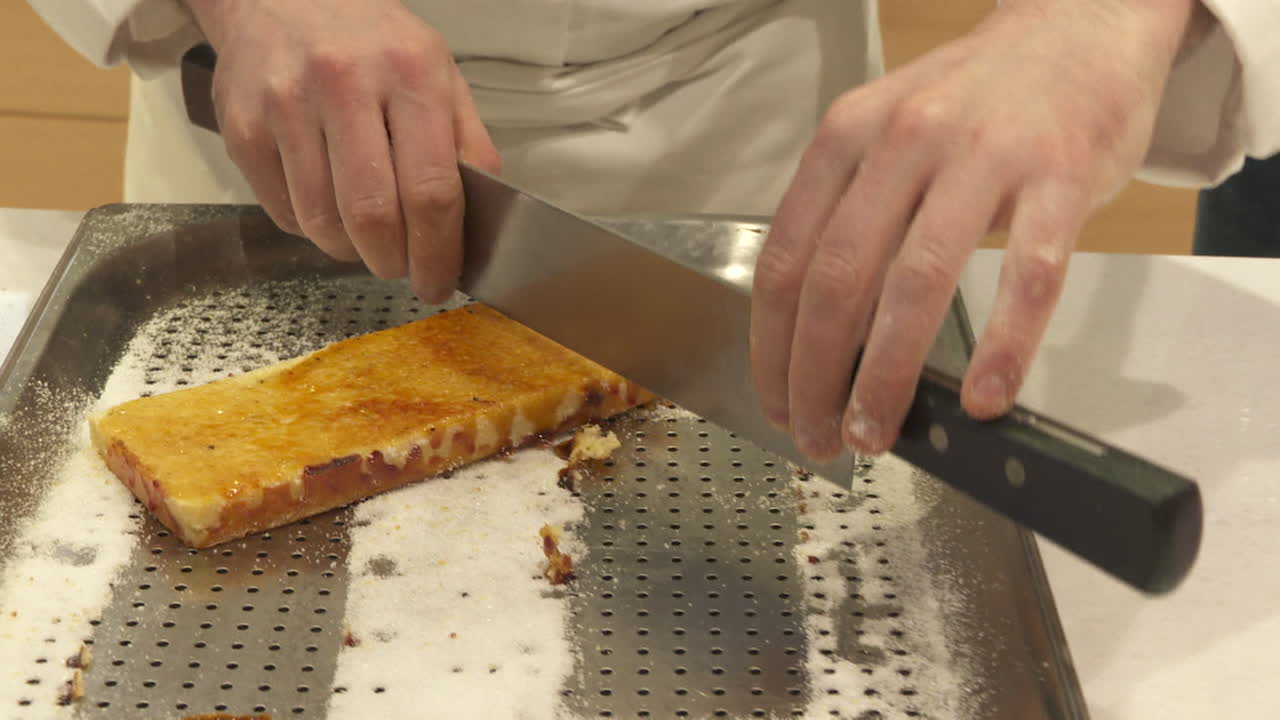 Chef Cutting a Piece of Torrone