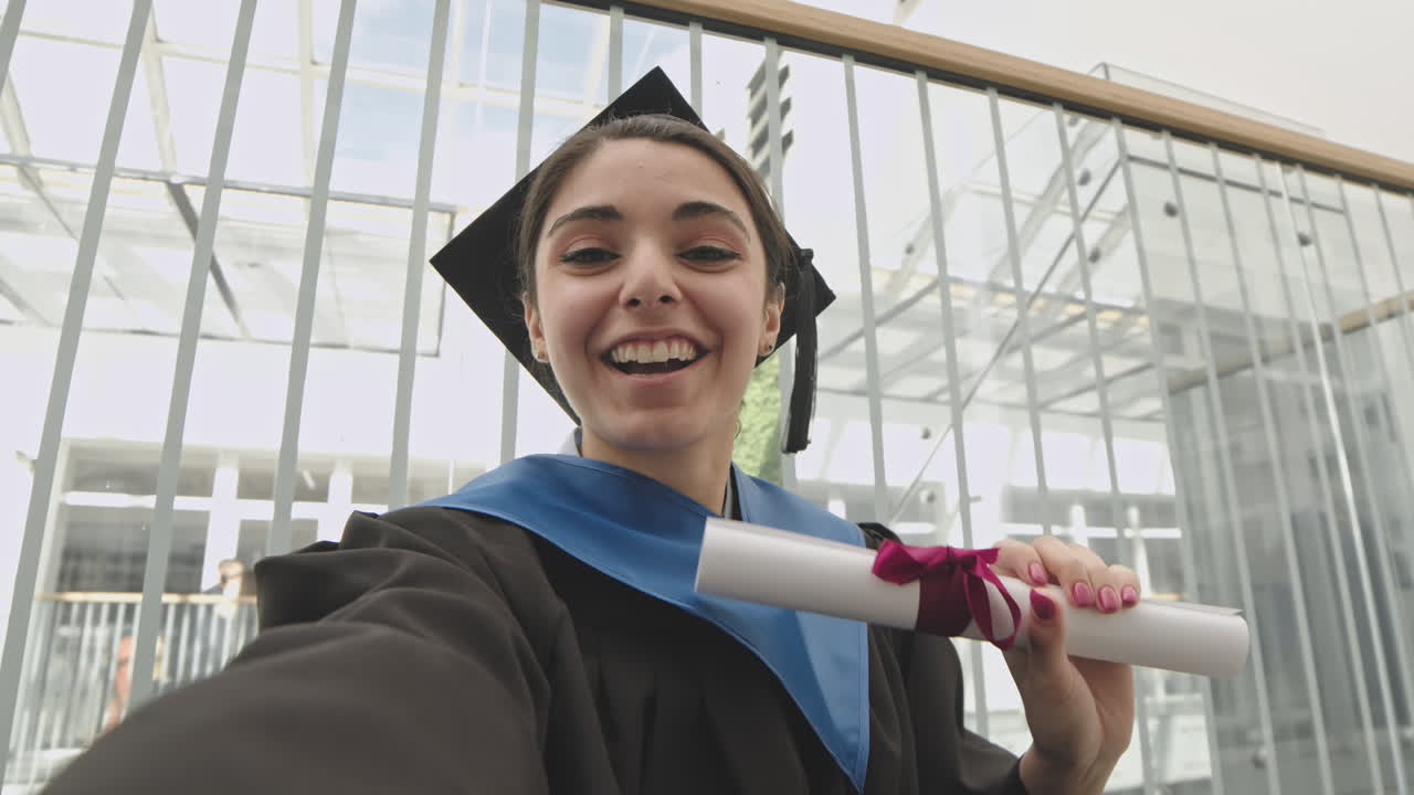 Cheerful Female Graduate Making Video Call