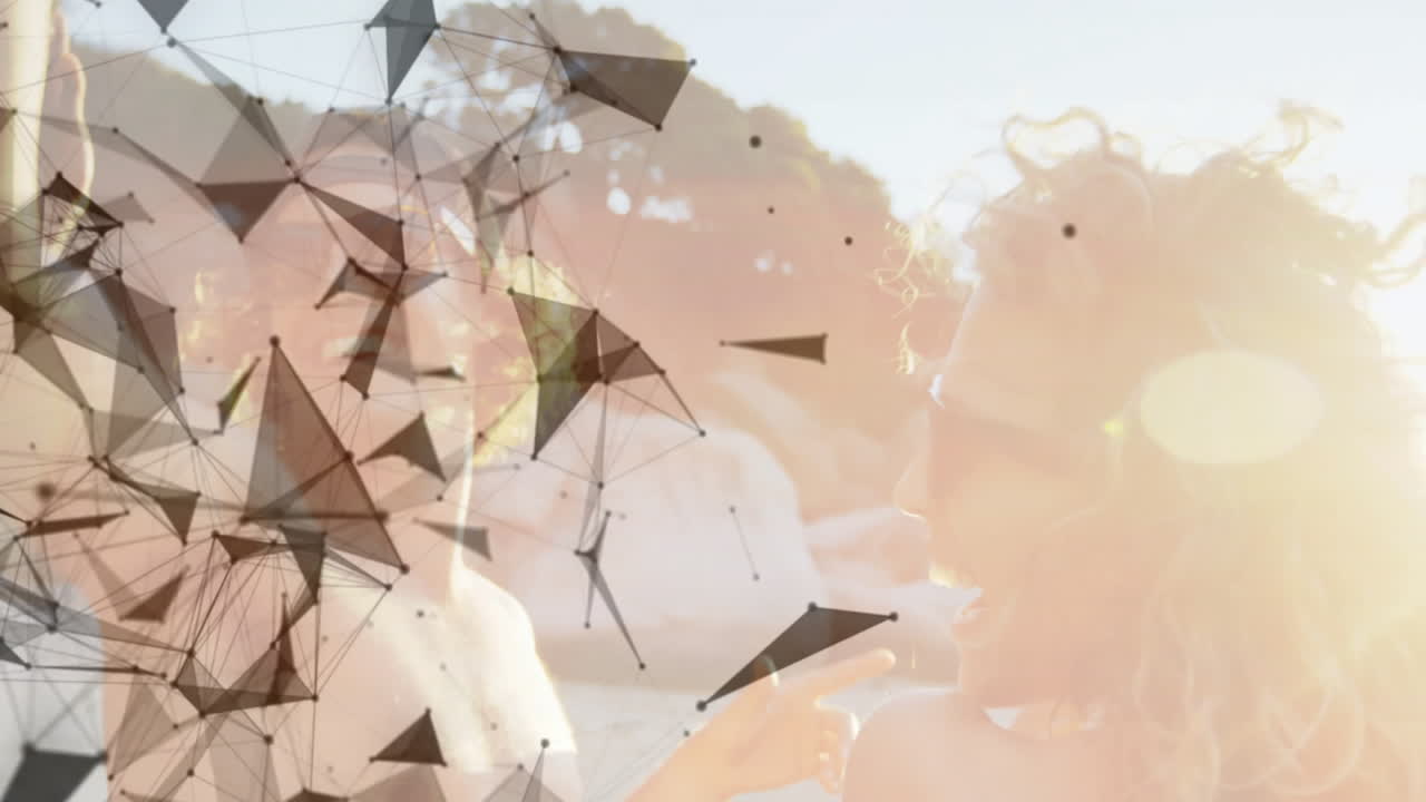 Abstract geometric shapes animation over people enjoying sunny day outdoors