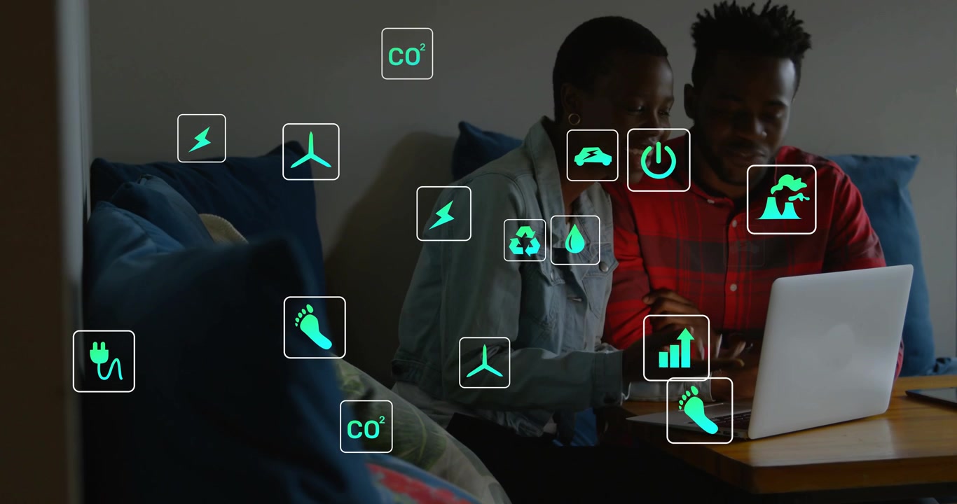Left woman touching laptop, couple leaning, green energy icons spreading around, showing CO2 data