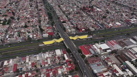 aerial pan across ecatepec's main avenue, showcasing cdmx metro stations