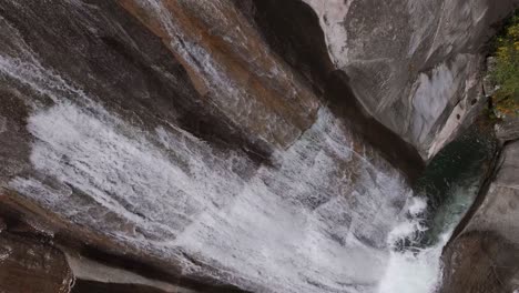 water from rio cerves flowing through the waterfall in ourense, melon, spain. - aerial shot