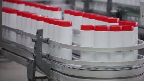 bottles moving on a conveyor belt in a factory