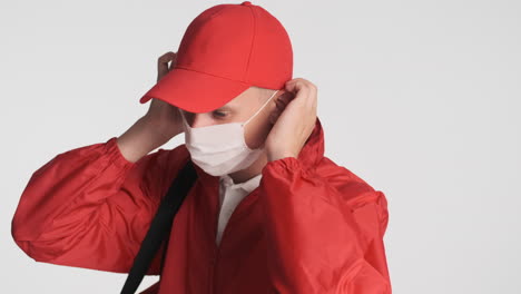 delivery boy with backpack wearing face mask