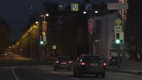 night city street scene with traffic and pedestrians