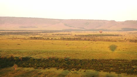 african safari adventure tourism in maasai mara national reserve in hot air balloon ride, kenya, africa landscape in masai mara north conservancy