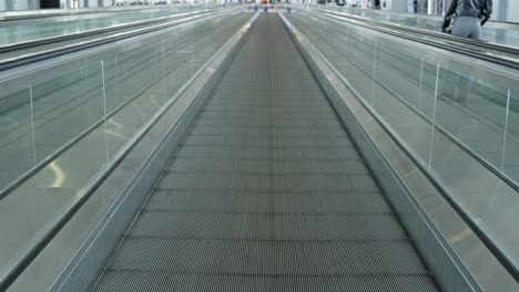 easy travel is airport with horizontal escalator, pov view