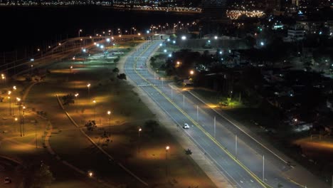 aerial view of the coastal city of posadas misiones argentina, drone shot of densely populated coastal city at night