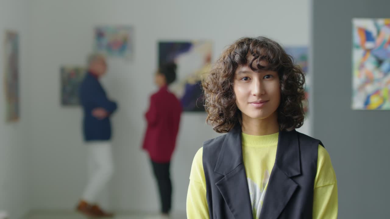 Portrait of Young Pretty Woman in Art Gallery