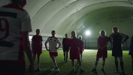 female soccer players training indoors