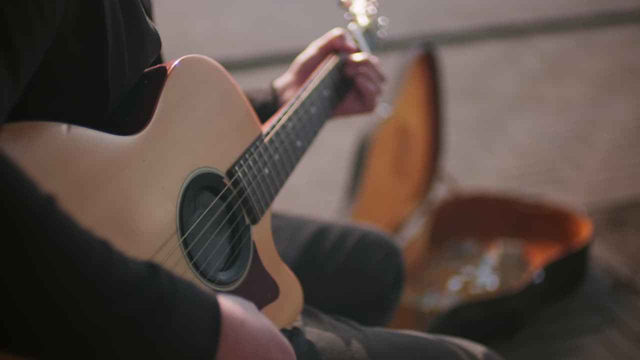 Unrecognizable Male Musician Playing Guitar Outdoors