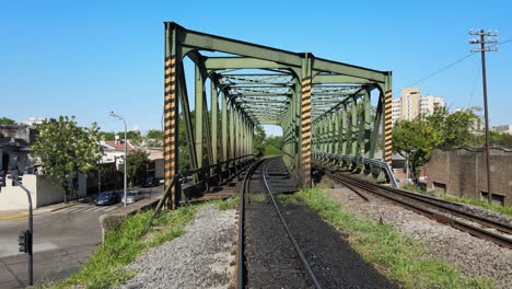 aerial ascent from the railway over an arched bridge