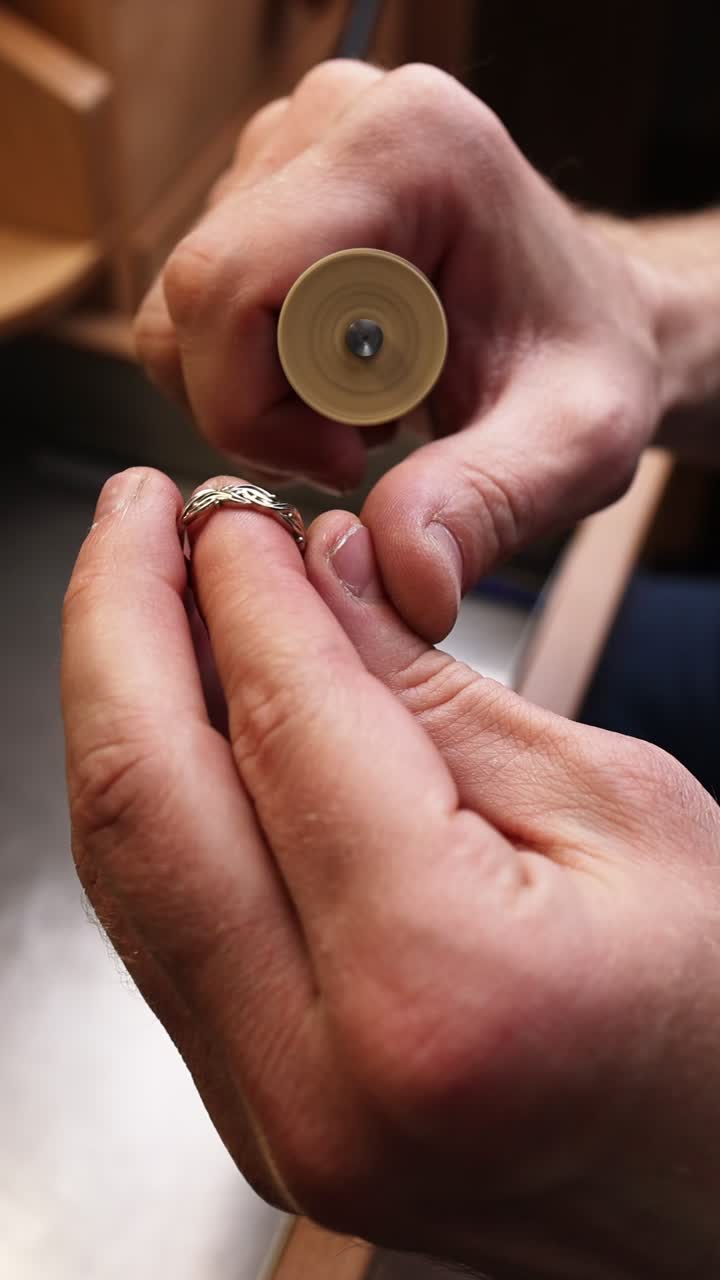 Close-Up of a Craftsman Polishing a Gold Ring