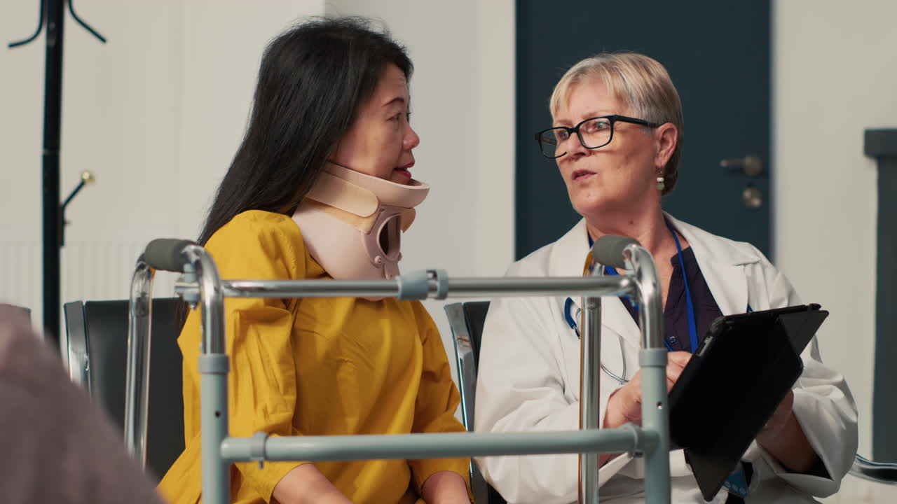 Doctor consulting with a patient wearing a neck brace