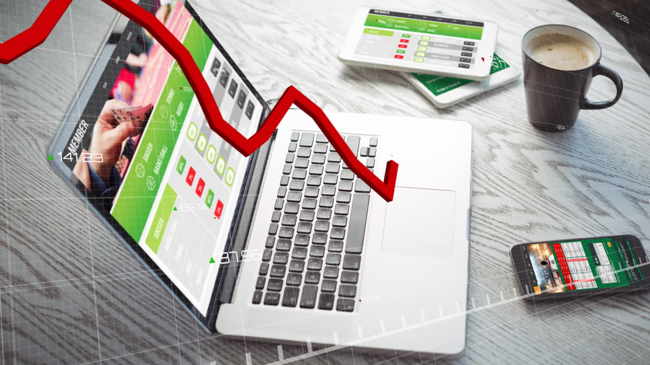 Animation of red line graph representing loss over laptop and tablets with coffee cup on desk