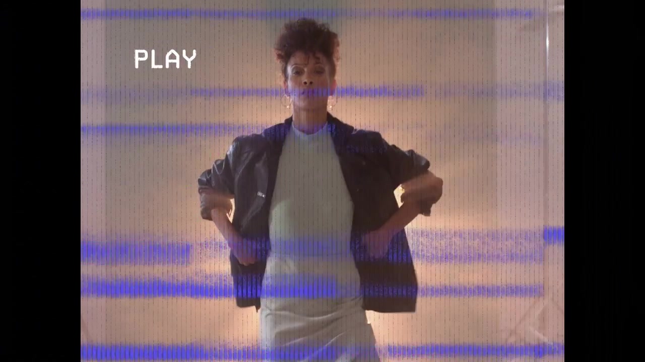 Model adjusting jacket and posing for party ad PLAY icon over her, PARTY animating, glitch sweeping