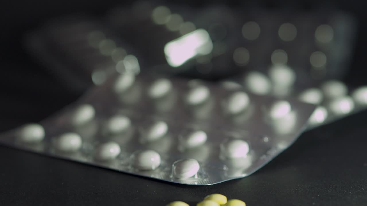 Slide shot of blisters with pills. Infection control concept. COVID 2019.Scene D.