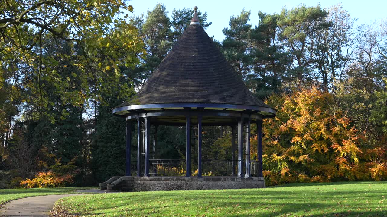 Historic Victorian bandstand in Leek Brough Park, peaceful British countryside