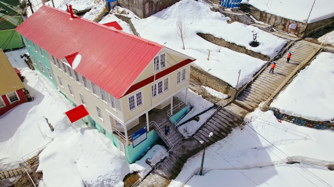 Drone panning in front of the Engineering Office, sunny day in Sewell, Chile
