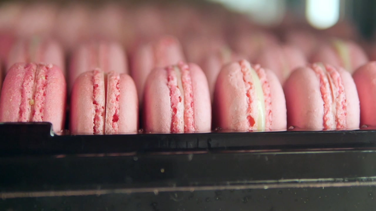 Close-up View of Pink French Macarons on a Tray