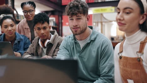 group of students studying together in a library