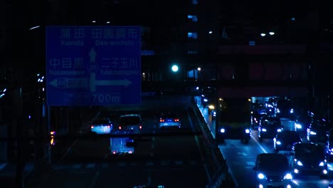 a night timelapse of the traffic jam at the city street in tokyo long shot
