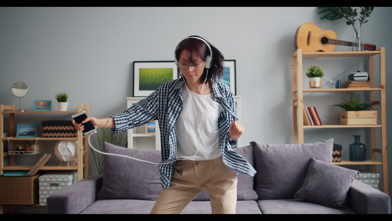 Woman Dancing to Music at Home