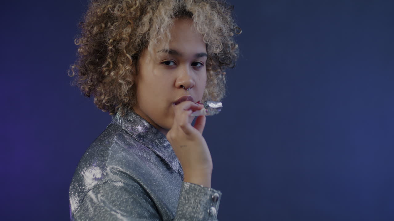 Woman Celebrating with Party Horn