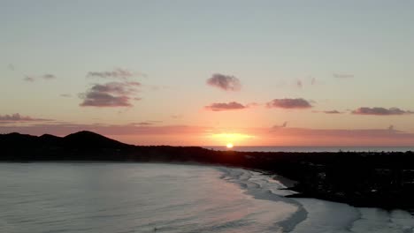 aerial shot of a beautiful sunrise over byron bay in australia